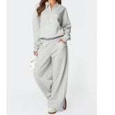 Gray sweatshirt and pants set on a white background